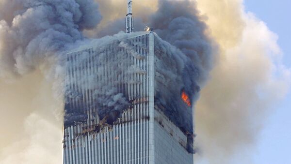 Fire and smoke billows from the north tower of New York's World Trade Center Tuesday Sept. 11, 2001 after terrorists crashed two hijacked airliners into the World Trade Center and brought down the twin 110-story towers. - اسپوتنیک افغانستان  