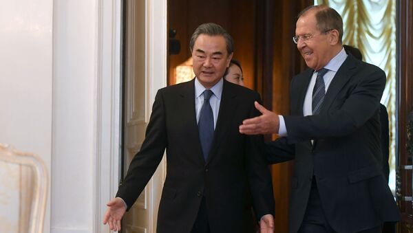 Министр иностранных дел Китая Ван И и министр иностранных дел РФ Сергей Лавров во время встречи в Москве - اسپوتنیک افغانستان  