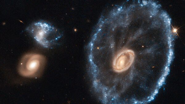 Изображение далекой галактики под названием Колесо телеги (Cartwheel Galaxy), сделанное с помощью космического телескопа НАСА Hubble - اسپوتنیک افغانستان  