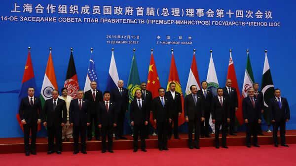 Russian Prime Minister Dmitry Medvedev, first row fifth left, during joint photo opportunity with SCO heads of government and heads of delegations of observer states. (File) - اسپوتنیک افغانستان  
