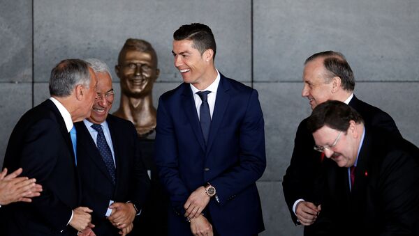 Real Madrid forward Cristiano Ronaldo attends the ceremony to rename Funchal airport as Cristiano Ronaldo Airport in Funchal, Portugal March 29, 2017.  - اسپوتنیک افغانستان  