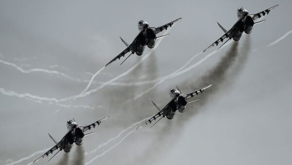 MiG-29 multipurpose fighter aircraft of the Swifts aerobatic team participate in an airshow at the Kubinka air base during the international military-technical forum ARMY-2016. (File) - اسپوتنیک افغانستان  