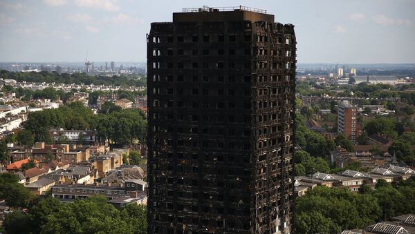 The burnt out remains of the Grenfell apartment tower are seen in North Kensington, London, Britain, June 18, 2017. - اسپوتنیک افغانستان  