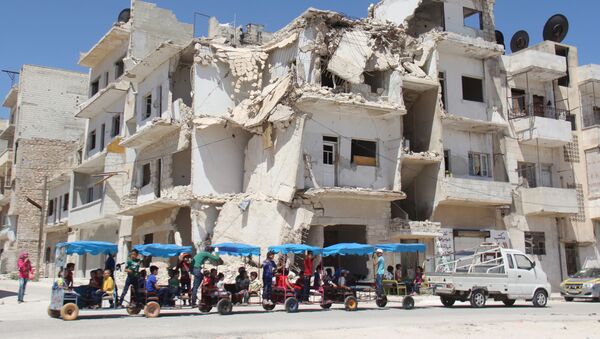 Разрушенное здание в сирийском городе Идлиб - اسپوتنیک افغانستان  