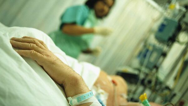 Intensive care. Hand of a patient who is being attended by a nurse in an intensive care unit (ICU) - اسپوتنیک افغانستان  