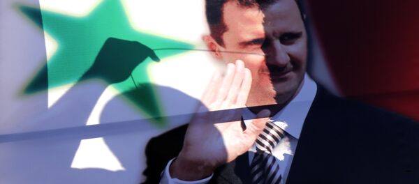 The silhouette of a Syrian man is seen through an election campaign portrait of President Bashar al-Assad he hangs it on a billboard on May 11, 2014 in the capital Damascus. The silhouette of a Syrian man is seen through an election campaign portrait of President Bashar al-Assad he hangs it on a billboard on May 11, 2014 in the capital Damascus. - اسپوتنیک افغانستان