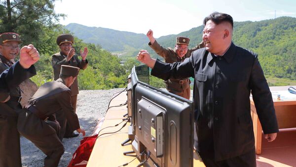 North Korean Leader Kim Jong Un reacts during the test-fire of intercontinental ballistic missile Hwasong-14 in this undated photo released by North Korea's Korean Central News Agency (KCNA) in Pyongyang, July, 4 2017. - اسپوتنیک افغانستان  