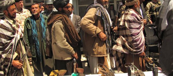 Former Taliban fighters line up to handover their Rifles Former Taliban fighters line up to handover their Rifles - اسپوتنیک افغانستان