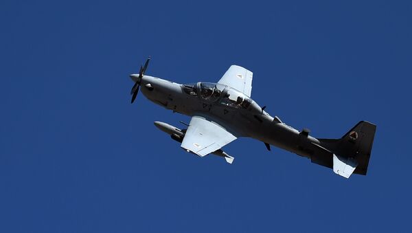 In this photograph taken on October 18, 2016, an Afghan Air Force Embraer A-29 Super Tucano aircraft flies during an airstrike training mission on the outskirts of Logar province - اسپوتنیک افغانستان  
