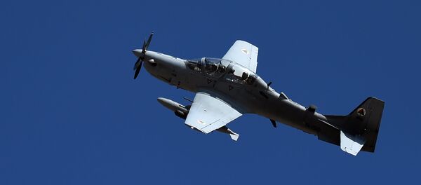 In this photograph taken on October 18, 2016, an Afghan Air Force Embraer A-29 Super Tucano aircraft flies during an airstrike training mission on the outskirts of Logar province In this photograph taken on October 18, 2016, an Afghan Air Force Embraer A-29 Super Tucano aircraft flies during an airstrike training mission on the outskirts of Logar province - اسپوتنیک افغانستان