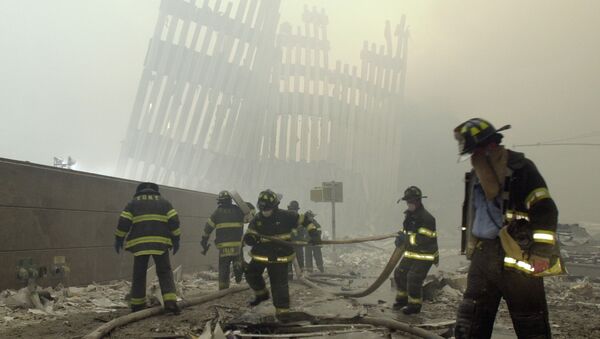 Firefighters work beneath the destroyed mullions, the vertical struts which once faced the soaring outer walls of the World Trade Center towers, after a terrorist attack on the twin towers in New York. (File) - اسپوتنیک افغانستان  