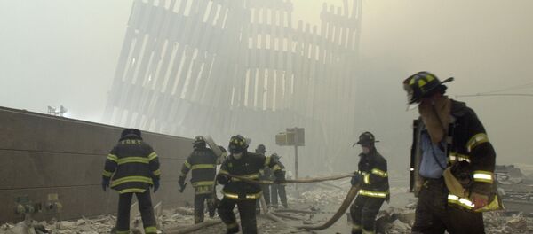 Firefighters work beneath the destroyed mullions, the vertical struts which once faced the soaring outer walls of the World Trade Center towers, after a terrorist attack on the twin towers in New York. (File) - اسپوتنیک افغانستان  