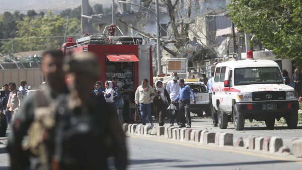 Security forces and medics work the site of a suicide attack in Kabul, Afghanistan - اسپوتنیک افغانستان  