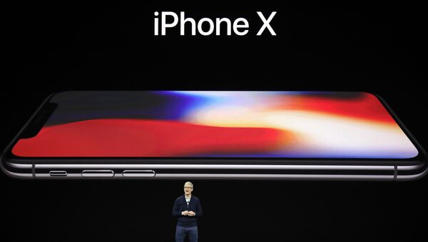 Apple CEO Tim Cook announces the new iPhone X at the Steve Jobs Theater on the new Apple campus, Tuesday, Sept. 12, 2017, in Cupertino, California. - اسپوتنیک افغانستان  
