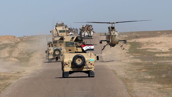 In this Wednesday, March 9, 2016 photo, Iraqi Defense Minister Khaled al-Obeidi's convoy tours the front line in their fight against Islamic State group militants in the Samarra desert, on the border between Anbar and Salahuddin provinces, Iraq - اسپوتنیک افغانستان  