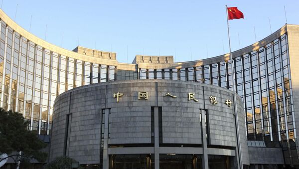 In this Nov. 27, 2008, file photo released by China's Xinhua News Agency, a Chinese flag flutters in front of the headquarters of the People's Bank of China (PBOC) in Beijing - اسپوتنیک افغانستان  