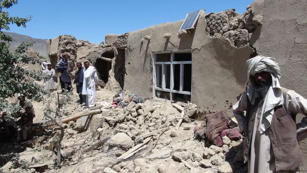 Afghan villagers gather near a destroyed house in Logar province, south of Kabul, Afghanistan (File) - اسپوتنیک افغانستان  