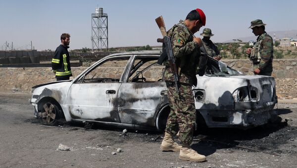 Поврежденная машина на месте взрыва в афганской провинции Пактия - اسپوتنیک افغانستان  