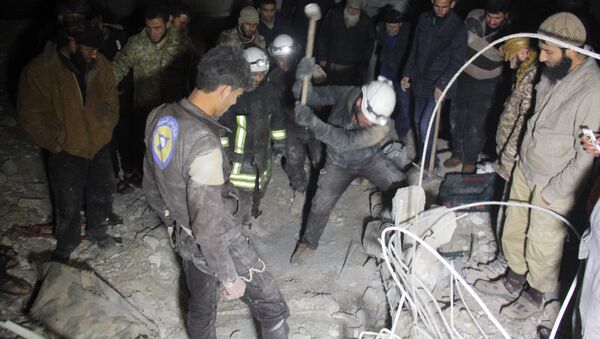 Syrian civil defence volunteers, known as the White Helmets, dig through the rubble of a mosque following a reported airstrike on a mosque in the village of Al-Jineh in Aleppo province late on March 16, 2017 - اسپوتنیک افغانستان  