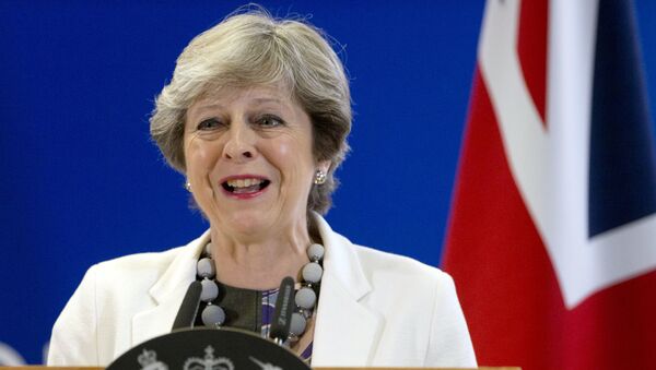 British Prime Minister Theresa May Theresa May speaks during a media conference at an EU summit in Brussels on Friday, Oct. 20, 2017. - اسپوتنیک افغانستان  