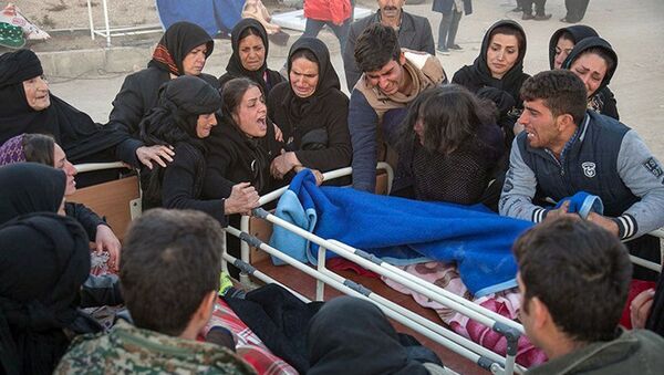 Родственники жертв землетрясения в Иране - اسپوتنیک افغانستان  