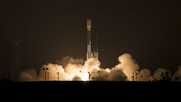 This photo provided by NASA, A Delta 2 rocket carrying the Soil Moisture Active Passive, SMAP ,satellite launches early Saturday, Jan. 31, 2015 from Vandenberg Air Force Base, Calif. - اسپوتنیک افغانستان  