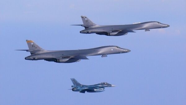 Two U.S. Air Force B-1B Lancer bombers fly a 10-hour mission from Andersen Air Force Base, Guam, escorted by a Japan Air Self-Defense Force F-2 fighter jet into Japanese airspace and then over the Korean Peninsula, July 30, 2017 - اسپوتنیک افغانستان  