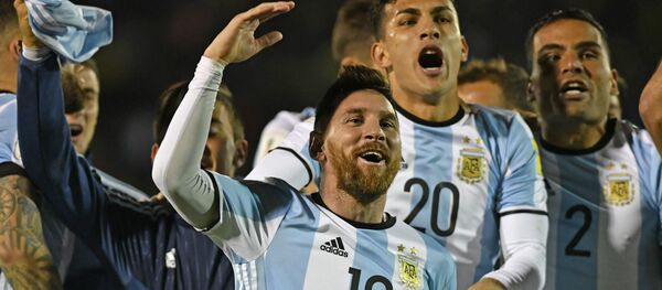 Argentina's Lionel Messi (C) celebrates after defeating Ecuador and qualifying to the 2018 World Cup football tournament, in Quito, on October 10, 2017 Argentina's Lionel Messi (C) celebrates after defeating Ecuador and qualifying to the 2018 World Cup football tournament, in Quito, on October 10, 2017 - اسپوتنیک افغانستان