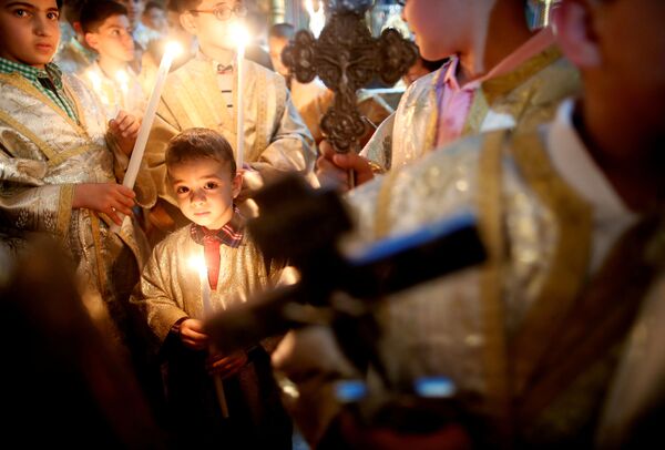 مسیحیان فلسطینی در حال تجلیل عید پاک با جشن ایستِر- نوار غزه - اسپوتنیک افغانستان  