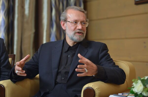 Speaker of the Islamic Consultative Council (parliament) of the Islamic Republic of Iran Ali Larijani during a meeting with Russian President Vladimir Putin following the 12th annual meeting of the Valdai International Discussion Club. File photo - اسپوتنیک افغانستان  