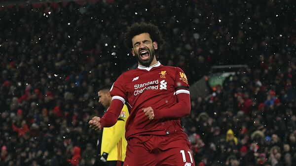 Liverpool's Mohamed Salah celebrates scoring his hat-trick during the English Premier League soccer match between Liverpool and Watford at Anfield, Liverpool, England - اسپوتنیک افغانستان  