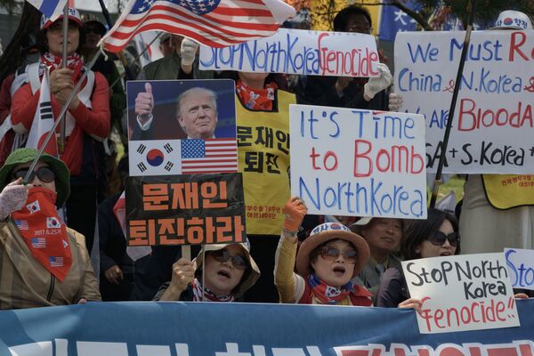 تظاهرات در واکنش به دیدار سران کوریای شمالی و جنوبی - اسپوتنیک افغانستان  