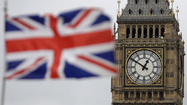 a British flag is blown by the wind near to Big Ben's clock tower in front of the UK Houses of Parliament in central London - اسپوتنیک افغانستان  