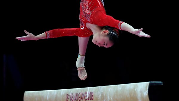 Китайская гимнастка Лю Тинтин во время выступления на соревнованиях Азиатские игры 2018 по художественной гимнастике - اسپوتنیک افغانستان  