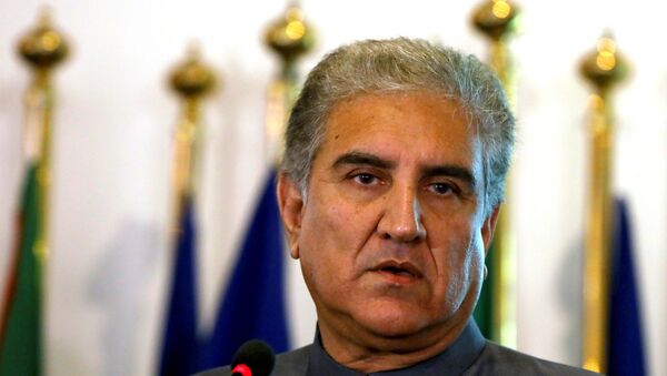 Pakistan's new Foreign Minister Shah Mehmood Qureshi listens during a news conference at the Foreign Ministry in Islamabad, Pakistan August 20, 2018 - اسپوتنیک افغانستان  