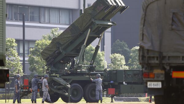 Japan Self-Defense Force members set up a PAC-3 Patriot missile unit deployed ahead of North Korea's planned rocket launch at the Defense Ministry in Tokyo, Tuesday, June 21, 2016 - اسپوتنیک افغانستان  