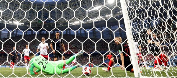 World Cup - Round of 16 - Croatia vs Denmark - Nizhny Novgorod Stadium, Nizhny Novgorod, Russia - July 1, 2018 Denmark's Mathias Jorgensen (hidden) scores their first goal past Croatia's Danijel Subasic - اسپوتنیک افغانستان  