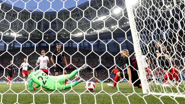 World Cup - Round of 16 - Croatia vs Denmark - Nizhny Novgorod Stadium, Nizhny Novgorod, Russia - July 1, 2018 Denmark's Mathias Jorgensen (hidden) scores their first goal past Croatia's Danijel Subasic - اسپوتنیک افغانستان  