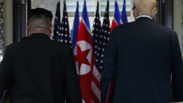 President Donald Trump and North Korean leader Kim Jong Un participate in a signing ceremony during a meeting on Sentosa Island, Tuesday, June 12, 2018, in Singapore - اسپوتنیک افغانستان  