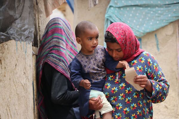 توزیع کمکهای بشردوستانه در کمپ پناهندگان در کابل با همکاری اسپوتنیک - اسپوتنیک افغانستان  