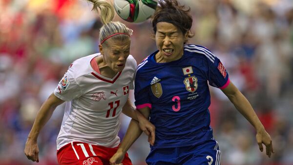 Switzerland forward Lara Dickenmann (L) and Japan defender Azusa Iwashimizu head the ball during a Group C football match between Switzerland and Japan at BC Place Stadium in Vancouver during the FIFA Women's World Cup Canada 2015 on June 8, 2015 - اسپوتنیک افغانستان  