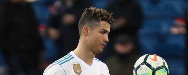 Soccer Football - La Liga Santander - Real Madrid vs Girona - Santiago Bernabeu, Madrid, Spain - March 18, 2018 Real Madrid's Cristiano Ronaldo with the matchball after the match Soccer Football - La Liga Santander - Real Madrid vs Girona - Santiago Bernabeu, Madrid, Spain - March 18, 2018 Real Madrid's Cristiano Ronaldo with the matchball after the match - اسپوتنیک افغانستان