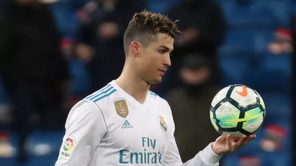 Soccer Football - La Liga Santander - Real Madrid vs Girona - Santiago Bernabeu, Madrid, Spain - March 18, 2018 Real Madrid's Cristiano Ronaldo with the matchball after the match - اسپوتنیک افغانستان  