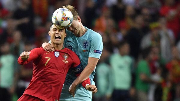 Portugal's Cristiano Ronaldo, left, jumps for the ball with Netherlands' Matthijs de Ligt during the UEFA Nations League final soccer match between Portugal and Netherlands at the Dragao stadium in Porto, Portugal, Sunday, June 9, 2019. - اسپوتنیک افغانستان  