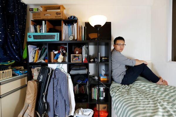 انجینر 26 ساله چینایی با مادر و پدرش در یک اتاق 7 متر مربع زندگی می‌کند - اسپوتنیک افغانستان  