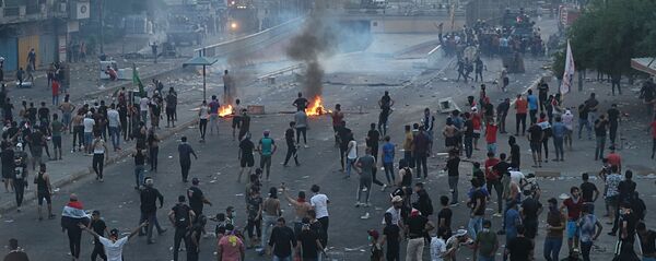 کشته شدن دستکم 65 تن در اعتراضات عراق کشته شدن دستکم 65 تن در اعتراضات عراق - اسپوتنیک افغانستان