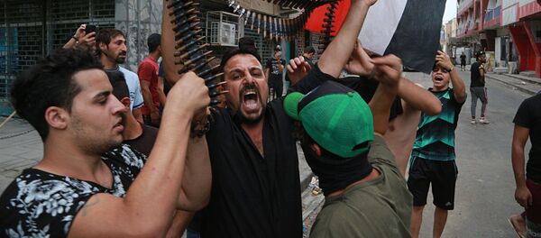 شاهدان عینی، پولیس عراق به طور  وحشتناک مردم را پراکنده می سازد - اسپوتنیک افغانستان  