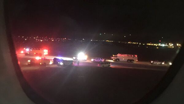 Emergency personnel are shown on the tarmac at Salt Lake City International Airport in this photograph taken by passenger Keith Rosso from a seat inside Air France flight 65, November 17, 2015 - اسپوتنیک افغانستان  