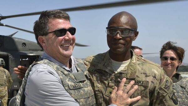 In this photo provided by the Department of Defense, then-U.S. Army Brig. Gen. Ron Lewis, right, greets then-Deputy Secretary of Defense Ash Carter, left, in Jalalabad, Afghanistan, May 13, 2013 - اسپوتنیک افغانستان  