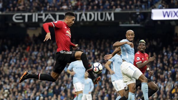 Manchester United's Chris Smalling, left, scores his side's third goal during the English Premier League soccer match between Manchester City and Manchester United at the Etihad Stadium in Manchester, England, Saturday April 7, 2018 - اسپوتنیک افغانستان  